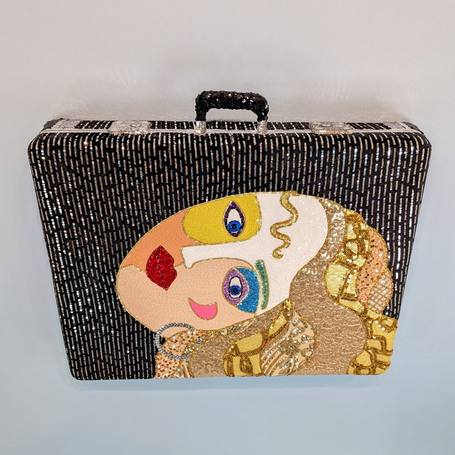 She Always Packs Sequins